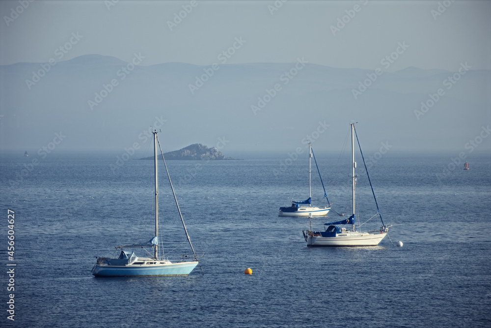 Forth view with yachts at anchor and a small island. The Firth of Forth, Scotland
