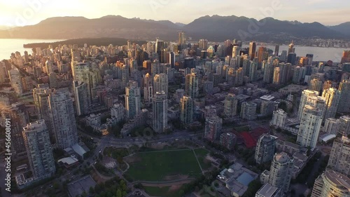 4K aerial Vancouver Skyline Sunset global backward view