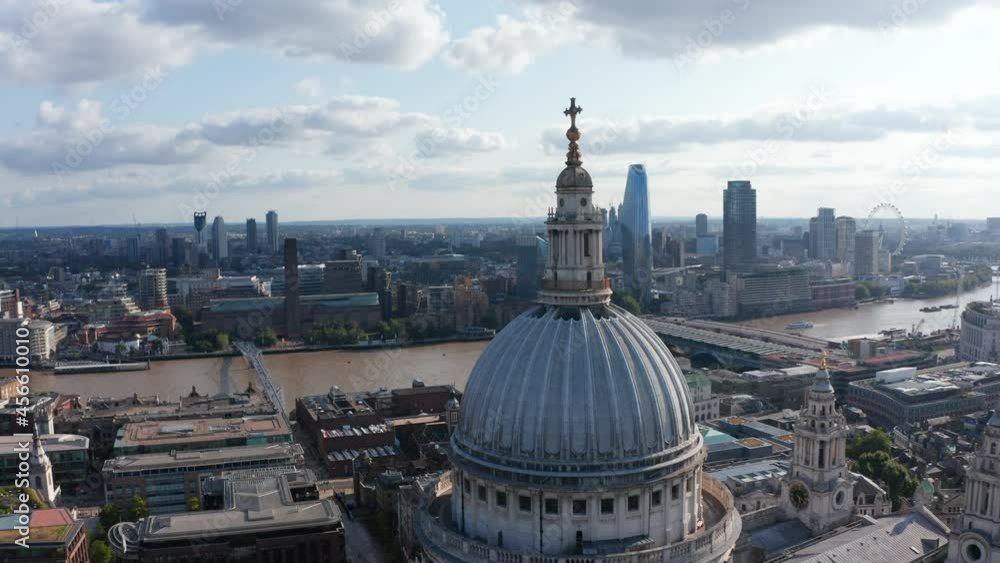Tight fly around top of Saint Pauls Cathedral. Aerial view of River