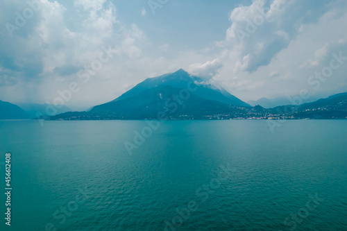 Photo of foggy mountains in Como lake on a cloudy day in Lombardy  Italy