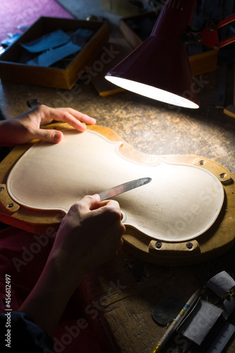 Obraz na plátně luthier while working on the creation of a violin