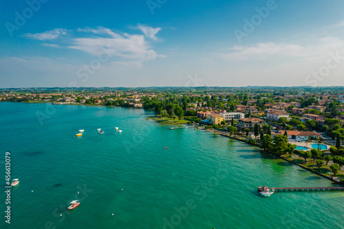 Aerial view of Sirmione resort coastline in Italy on the shore of Garda lake in Lombardy