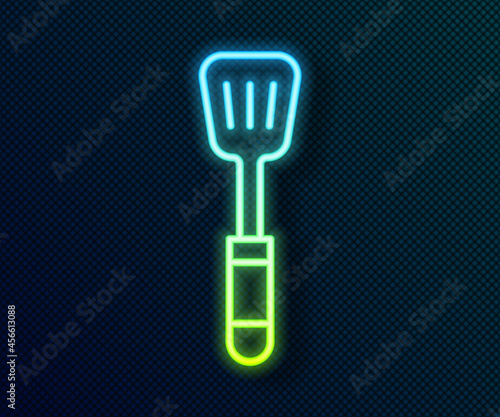 Glowing neon line Spatula icon isolated on black background. Kitchen spatula icon. BBQ spatula sign. Barbecue and grill tool. Vector