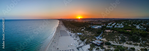 Aerial sunset seascape of famous Altura beach, Algarve.