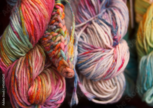 Multicolored cotton yarn for knitting. Hand-dyed threads. Modern tie dye on the thread skein