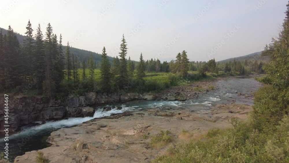 Empty Castle Falls on a smoky summer morning. Popular summer camping location in southern Alberta Castle falls Empty Castle Falls on a smoky summer morning. Popular summer camping location in southern Alberta Castle falls