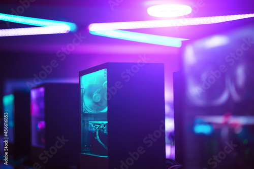 Colorful neon light server room with computers