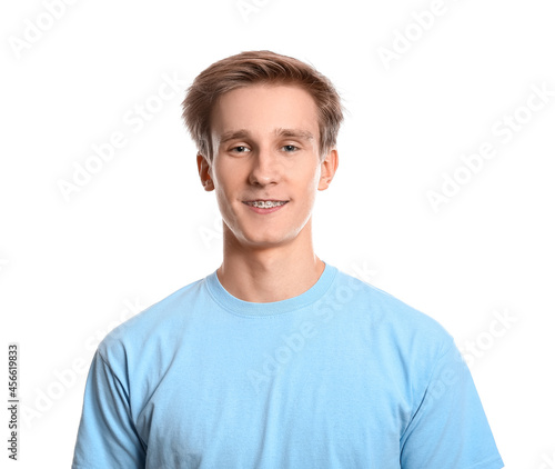 Handsome man with dental braces on white background