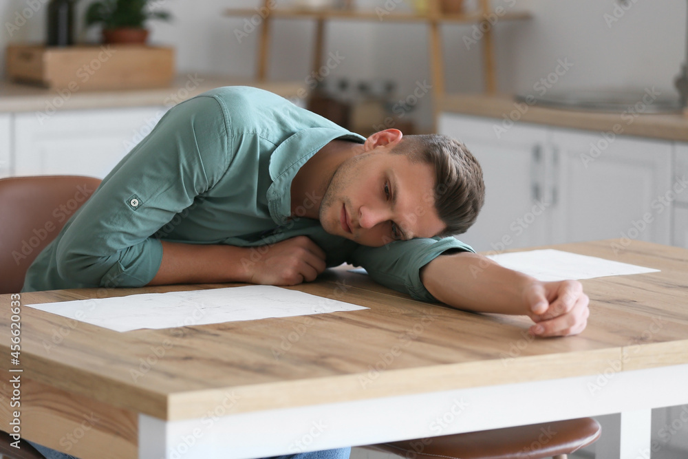 Depressed young man at home Depressed young man at home