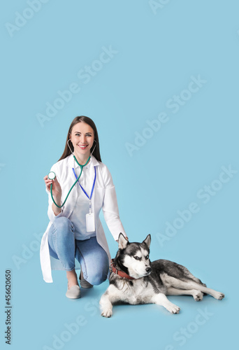 Veterinarian with cute dog ...