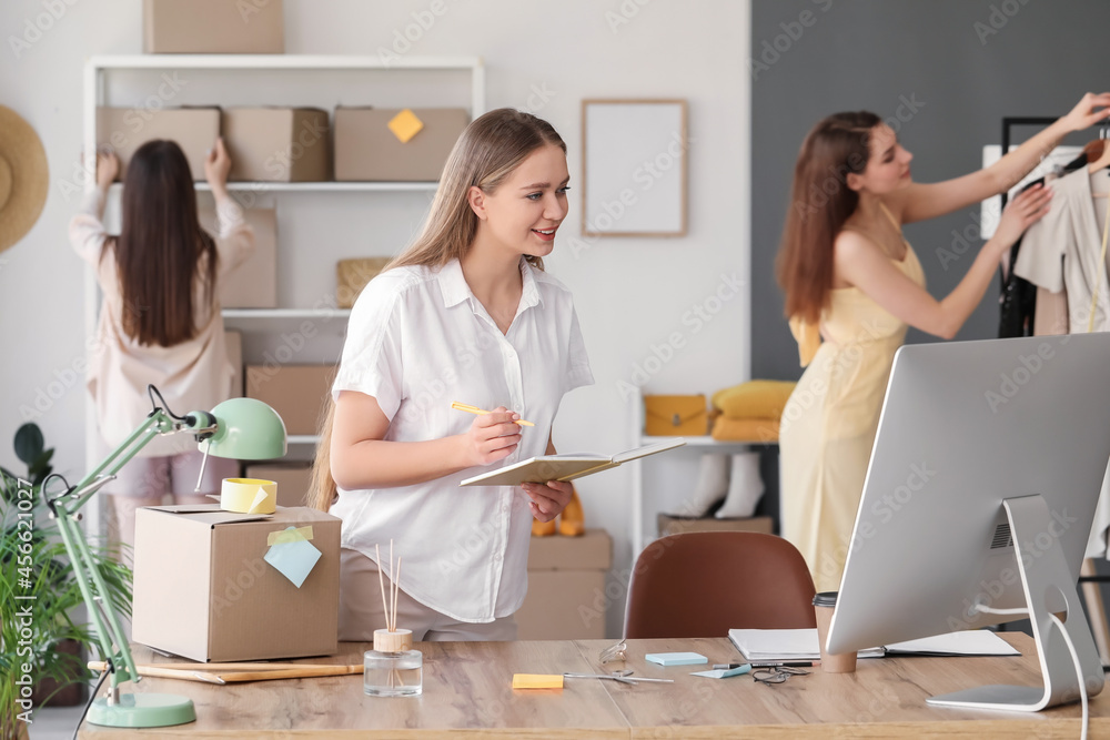 Female business owner processing order in warehouse store Female business owner processing order in warehouse store