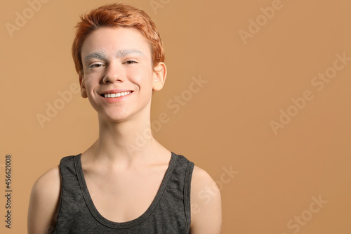 Teenage boy with dyed eyebr...