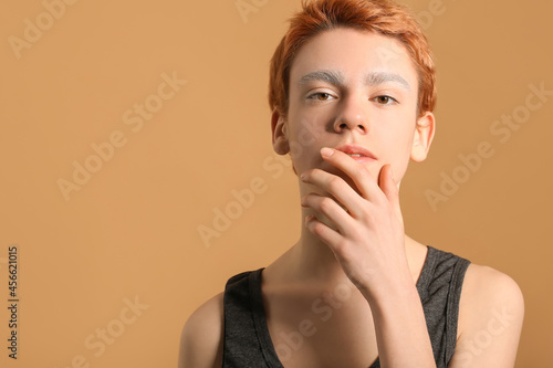 Teenage boy with dyed eyebr...