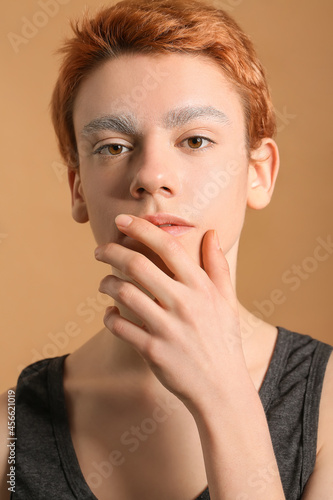 Teenage boy with dyed eyebr...