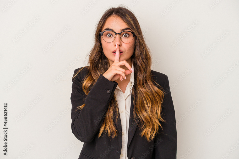 Young caucasian business woman isolated on white background keeping a secret or asking for silence. Young caucasian business woman isolated on white background keeping a secret or asking for silence.