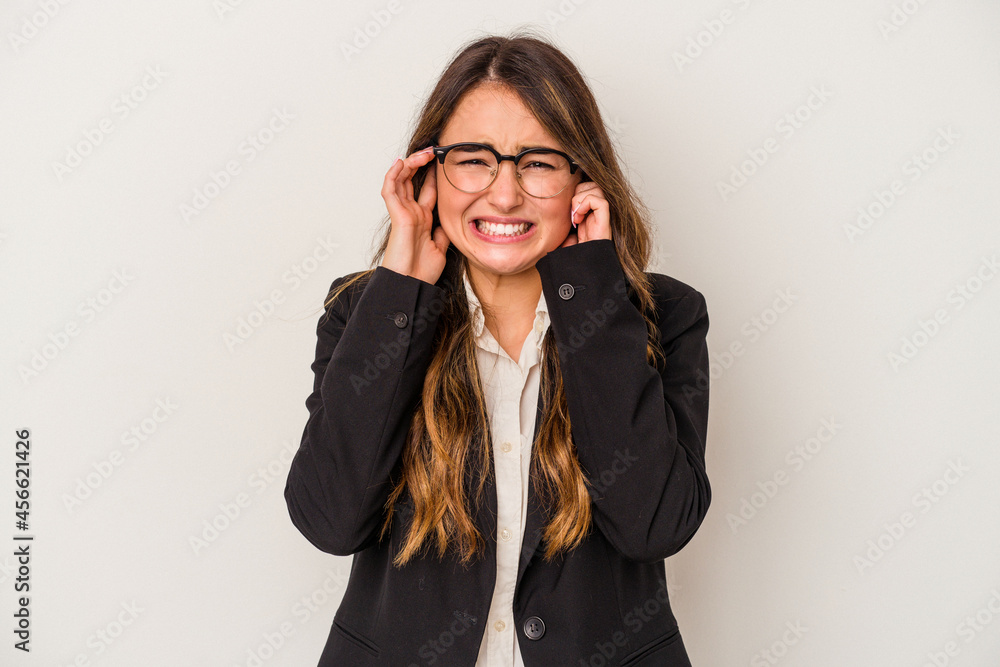 Young caucasian business woman isolated on white background covering ears with hands. Young caucasian business woman isolated on white background covering ears with hands.