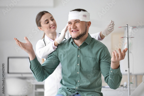 Doctor applying bandage ont...