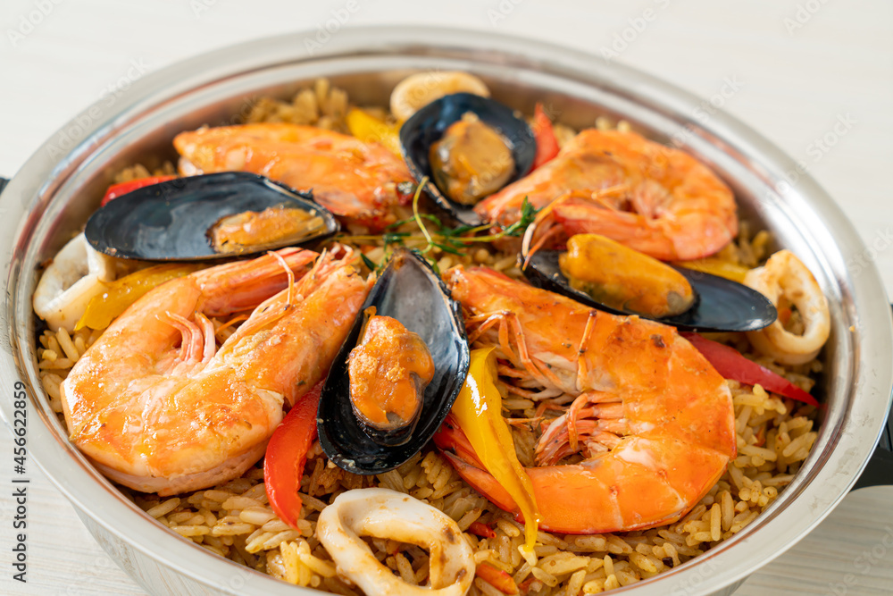 Seafood Paella with prawns, clams, mussels on saffron rice Seafood Paella with prawns, clams, mussels on saffron rice