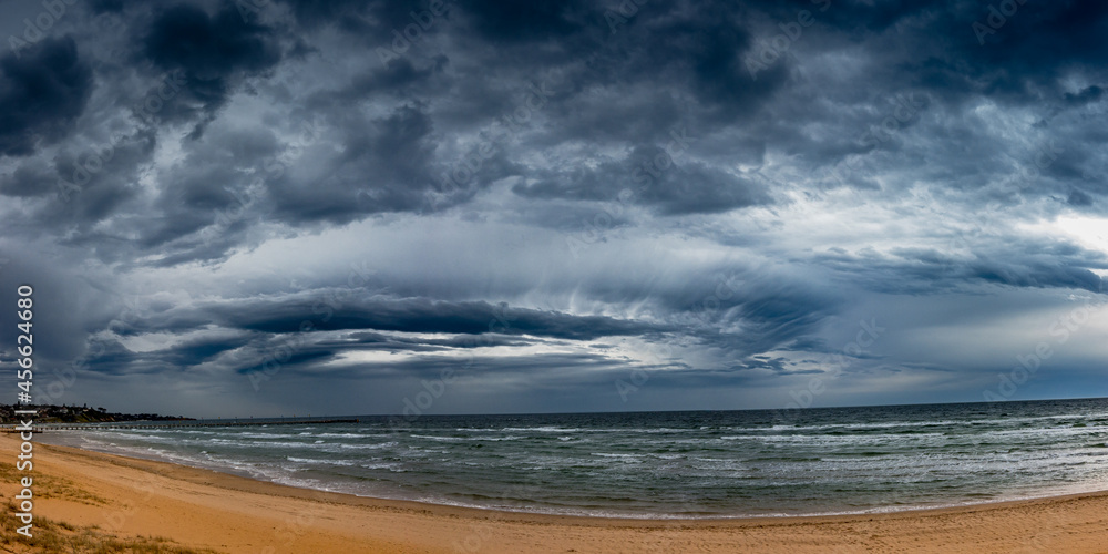 Menacing storm front rolling through Port Philip Bay approaching Frankston Beach