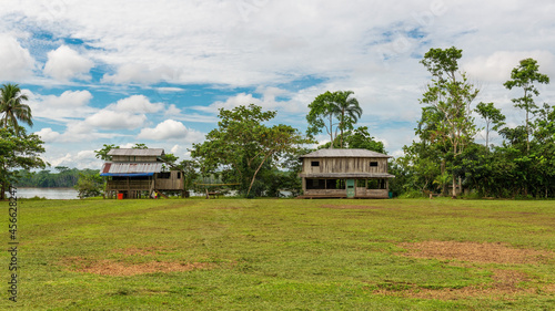 Main square with housing in the kichwa indigenous Zancudococha village by the Aguarico river, Cuyabeno wildlife reserve, Amazon Rainforest, Ecuador. photo