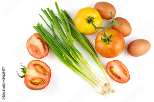 leek with tomato and egg isolated on white background with clipping path