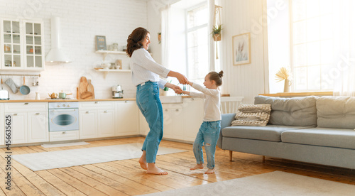 Принти на полотні Mom and her daughter are dancing.