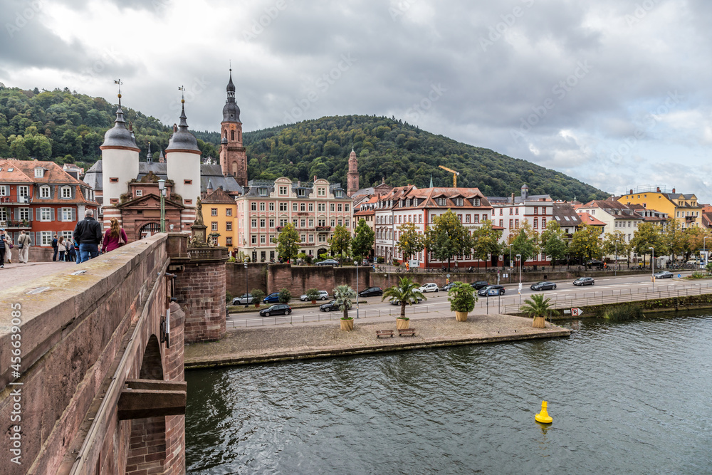Obraz premium Heidelberg, Germany. Old Bridge (Karl Theodor Bridge), embankment and Neckartor gate with two twin towers 