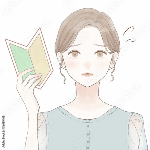 初心者マークを持っている、悩んでいる女性