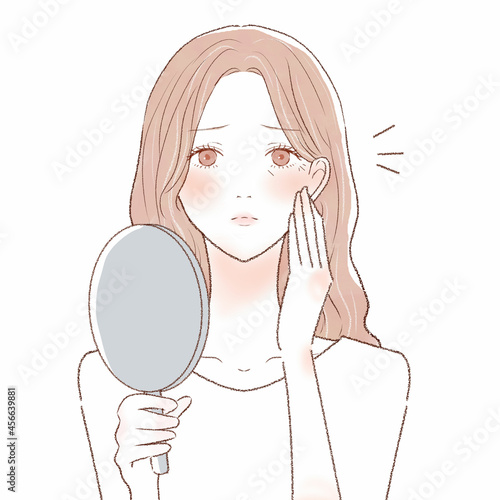 顔の小じわに悩む女性