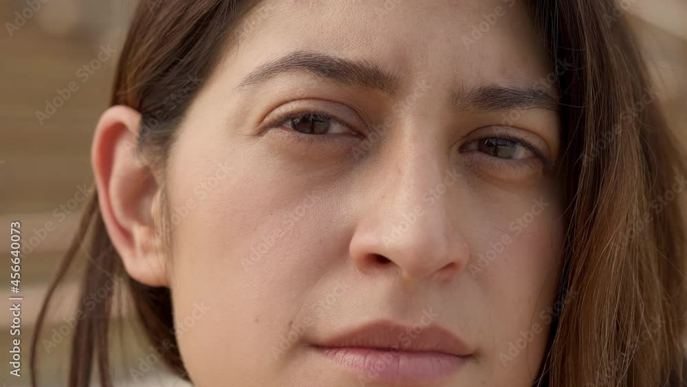 Outdoor portrait of a Latina woman looking at the camera with a serious face. Close up of a human face. Concept of people and emotions. Outdoor portrait of a Latina woman looking at the camera with a serious face. Close up of a human face. Concept of people and emotions.