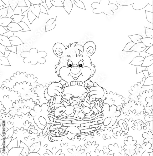 Little bear mushroomer friendly smiling and sitting with a big wicker basket full of picked mushrooms on a forest glade, black and white outline vector cartoon illustration