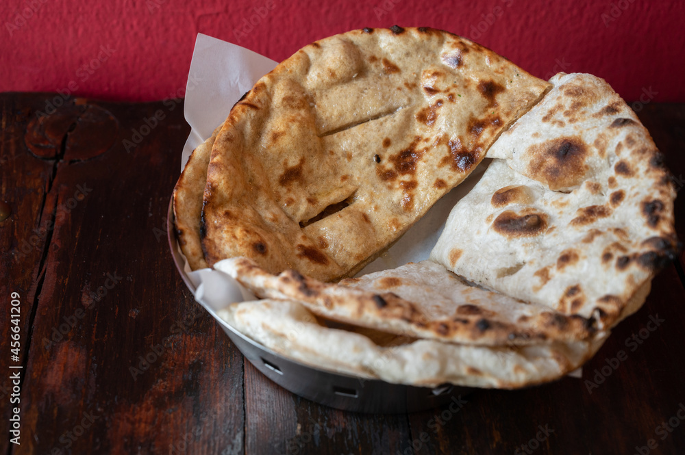 Homemade Roti (or Chapati) served on table. Roti is made of whole wheat flour and is eaten in India with dal and curries. Roti is an integral part of Indian cuisine.