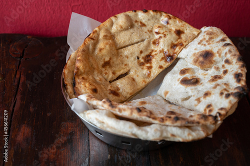 Homemade Roti  or Chapati  served on table. Roti is made of whole wheat flour and is eaten in India with dal and curries. Roti is an integral part of Indian cuisine.