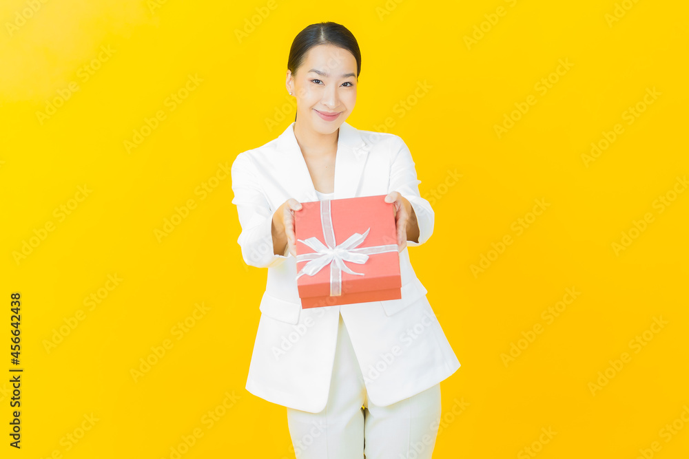 Portrait beautiful young asian woman smile with red gift box Portrait beautiful young asian woman smile with red gift box