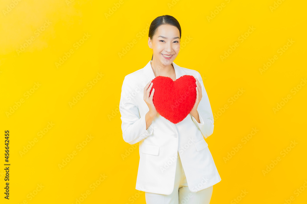 Portrait beautiful young asian woman smile with heart pillow shape Portrait beautiful young asian woman smile with heart pillow shape