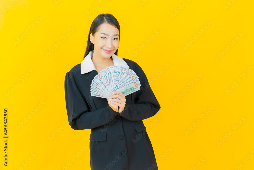 Portrait beautiful young asian woman smile with a lot of cash and money Portrait beautiful young asian woman smile with a lot of cash and money