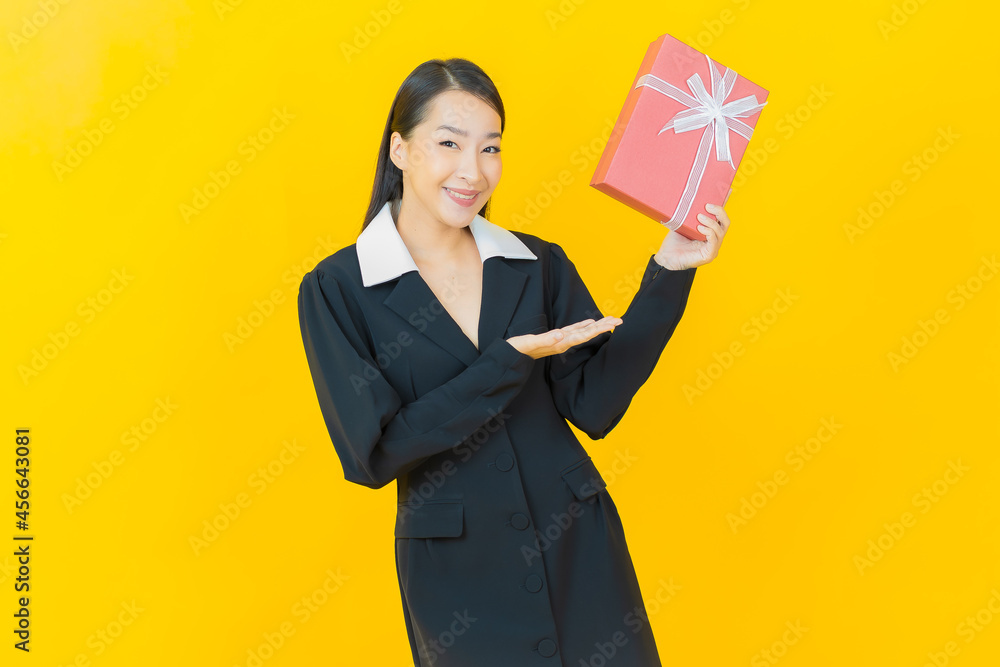 Portrait beautiful young asian woman smile with red gift box Portrait beautiful young asian woman smile with red gift box