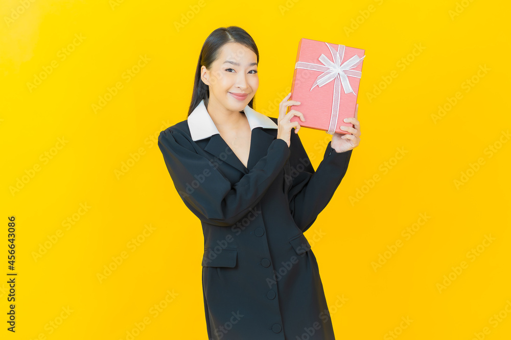 Portrait beautiful young asian woman smile with red gift box Portrait beautiful young asian woman smile with red gift box