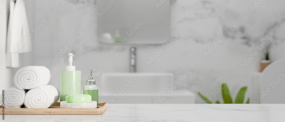 Closeup of marble countertop with space and set of bathing over stylish marble bathroom, 3d rendering Closeup of marble countertop with space and set of bathing over stylish marble bathroom, 3d rendering