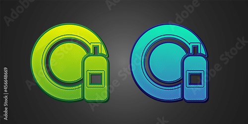 Green and blue Dishwashing liquid bottle and plate icon isolated on black background. Liquid detergent for washing dishes. Vector