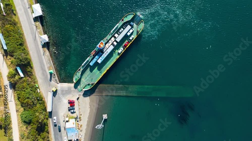 Timelapse Of Lorries Loading Onto Ferry From Chiloe Island. Aerial Top Down View photo