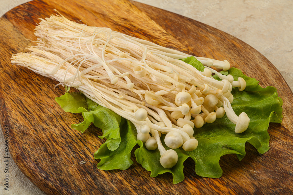 Raw Enoki mushrooms for cooking Raw Enoki mushrooms for cooking