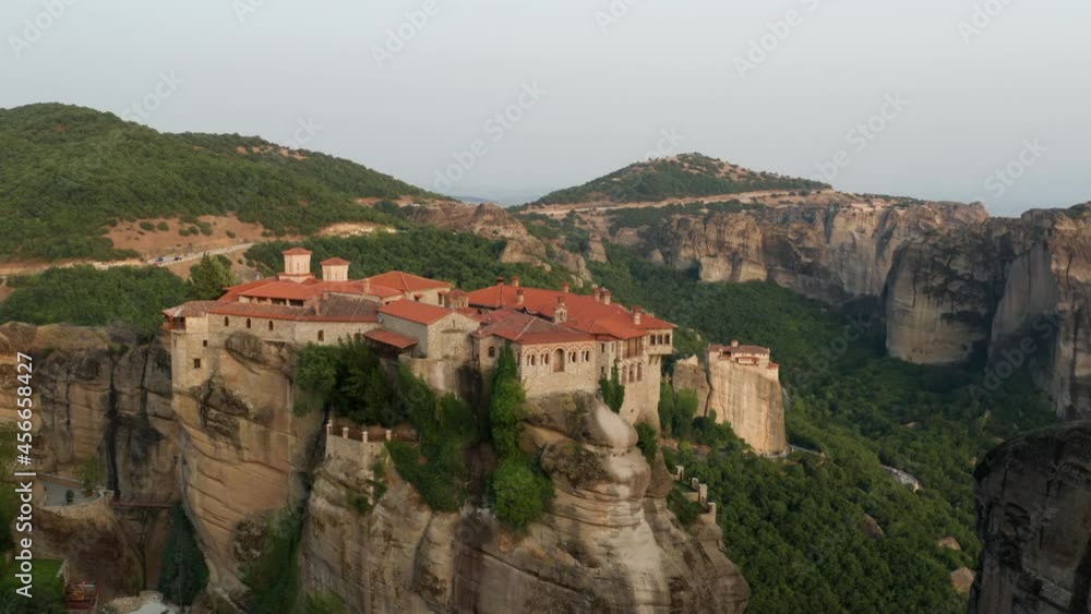 Varlaam Monastery Atop Escarpment Next To Great Meteoro Monastery In Meteora Complex, Greece. - Aerial Drone Varlaam Monastery Atop Escarpment Next To Great Meteoro Monastery In Meteora Complex, Greece. - Aerial Drone