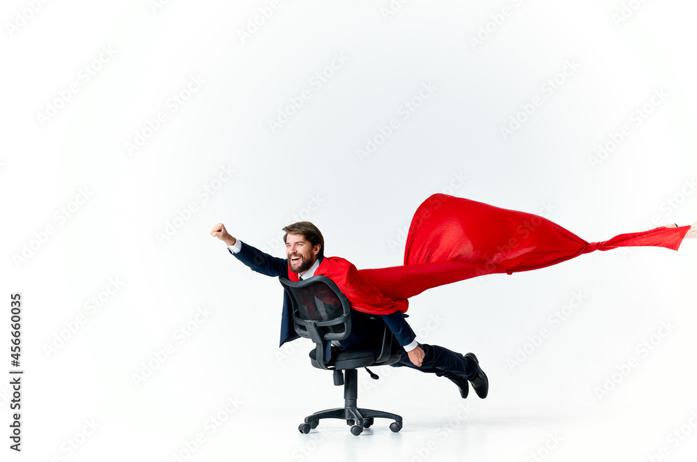 business man with red cloak in the chair hero superman