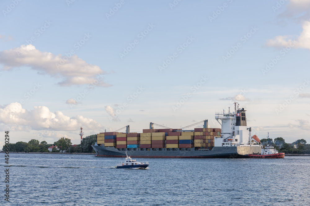 a large commercial cargo ship comes into port