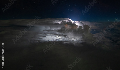 A tropical thunderstorm photographed from a commercial jet puts up an amazing lightning display.