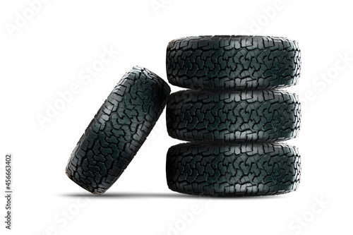 Stack of 4 wheels car tires designed for use in all road conditions with alloy wheel isolated on white background.