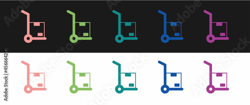 Set Hand truck and boxes icon isolated on black and white background. Dolly symbol. Vector
