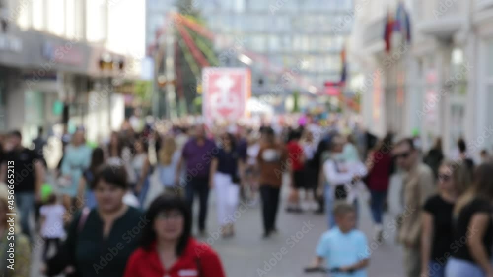 a crowd of people walking around the city for a holiday a crowd of people walking around the city for a holiday