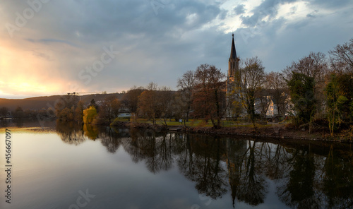 The old German city of Bad Ems. Evening landscape, view from the river to the church.